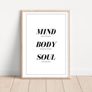 May include: A black and white printable wall art poster with the words "MIND OPEN YOUR MIND BODY NOURISH YOUR BODY SOUL FEED YOUR SOUL" in a modern font.