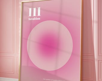 May include: A pink and white poster with a gold frame. The poster features the number 111 and the word "Intuition" in white text. A large pink circle is in the center of the poster. The text at the bottom of the poster reads: "The number of manifestation and prosperity. Do not be afraid to follow your intuition and trust your angelic guides."