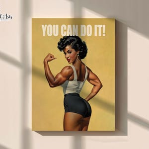 May include: A rectangular wall art print featuring a muscular individual with dark curly hair, wearing a white tank top and black shorts, flexing an arm. The background is a solid mustard yellow with the white text YOU CAN DO IT! at the top.