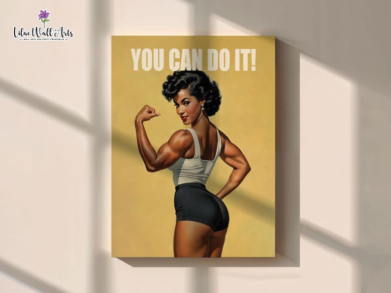 May include: A rectangular wall art print featuring a muscular individual with dark curly hair, wearing a white tank top and black shorts, flexing an arm. The background is a solid mustard yellow with the white text YOU CAN DO IT! at the top.