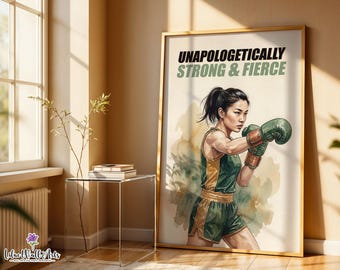 May include: A framed wall art print featuring an illustration of a boxer wearing green and gold athletic gear and boxing gloves. The text at the top reads UNAPOLOGETICALLY STRONG & FIERCE. The background has a soft, watercolor-style wash.