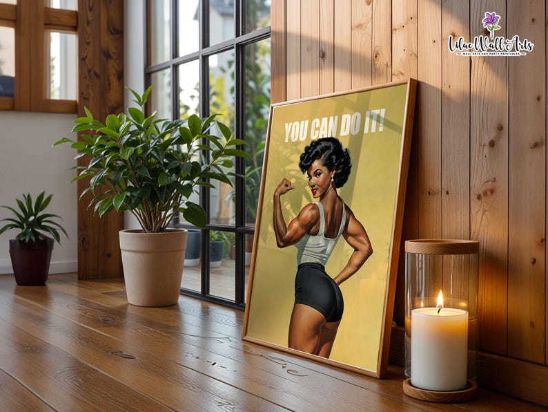 May include: A framed poster featuring a muscular person flexing their arm, wearing a white tank top and black shorts, with the text YOU CAN DO IT! printed in white at the top. The artwork is set against a yellow background with a vintage aesthetic.