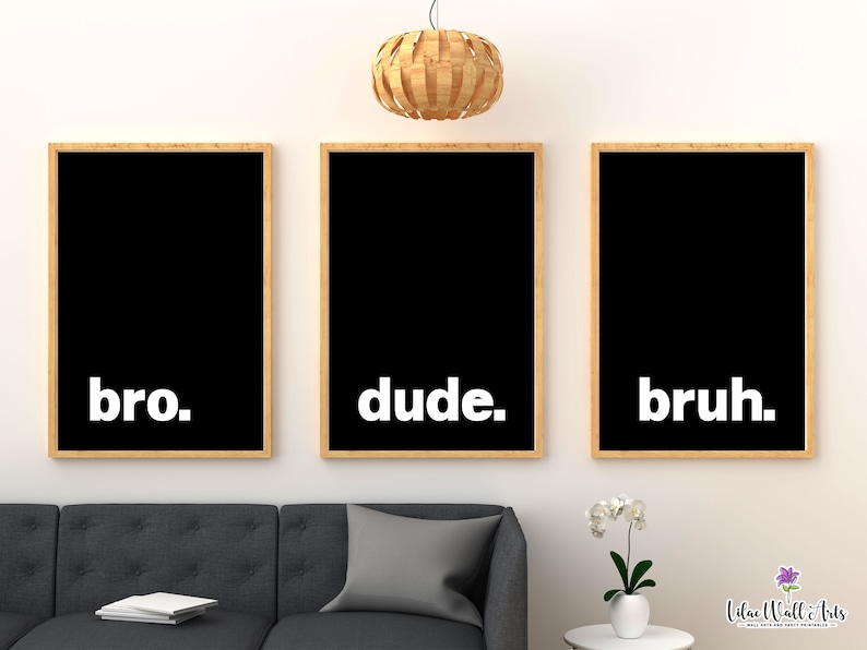 May include: Three black framed prints with white text on a white wall. The prints read "bro." "dude." and "bruh."