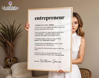 May include: A framed print with the definition of "entrepreneur" in black text on a white background. The definition includes humorous statements about entrepreneurs. The print is held by a person.