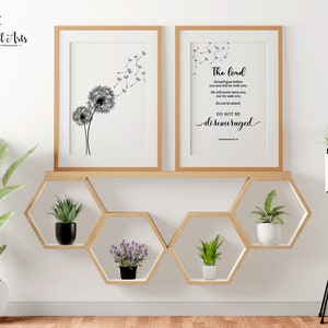 May include: Two framed prints featuring black and white dandelion illustrations. The print on the right includes the text "The Lord himself goes before you and will be with you; he will never leave you nor forsake you. Do not be afraid; do not be discouraged." Deuteronomy 31:8
