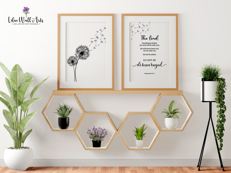 May include: Two framed prints featuring black and white dandelion illustrations. The print on the right includes the text "The Lord himself goes before you and will be with you; he will never leave you nor forsake you. Do not be afraid; do not be discouraged." Deuteronomy 31:8