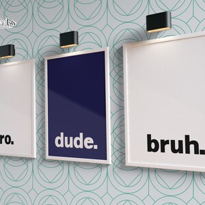 May include: Three white framed prints with black text on a light blue background with a geometric pattern. The prints read "bro." "dude." and "bruh."