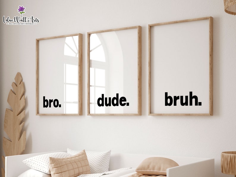 May include: Three framed prints with the words "bro", "dude", and "bruh" in black text on a white background.