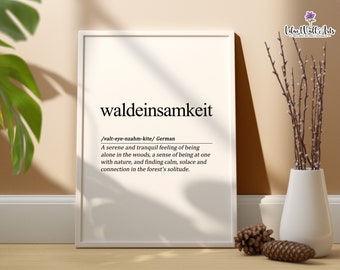 May include: A white framed print with the German word "waldeinsamkeit" and its definition: a serene and tranquil feeling of being alone in the woods, a sense of being at one with nature, and finding calm, solace and connection in the forest's solitude.