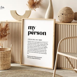 May include: A black and white printable wall art print with the word "my person" in bold text. The print defines the word "my person" as someone who is just made for you, someone who knows you better than everyone else, and the person you can't live without. The print also includes the text "Thank you for being my person! I love you always and forever!"