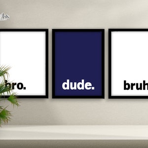 May include: Three framed prints with black frames and white backgrounds. The prints have the words "bro." "dude." and "bruh." in bold white text.