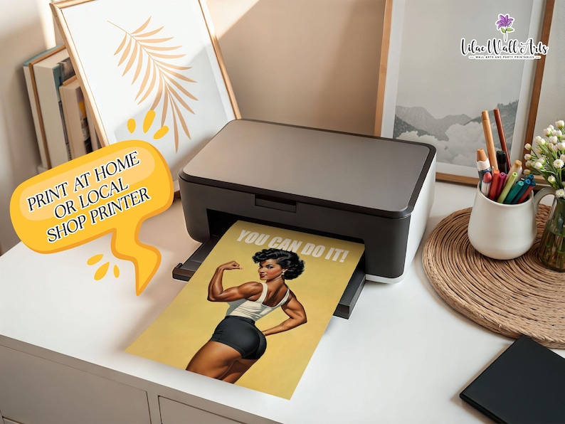 May include: A black and grey desktop printer outputting a yellow poster featuring a muscular person flexing their arm with the text YOU CAN DO IT! A yellow speech bubble graphic with the text PRINT AT HOME OR LOCAL SHOP PRINTER is visible.
