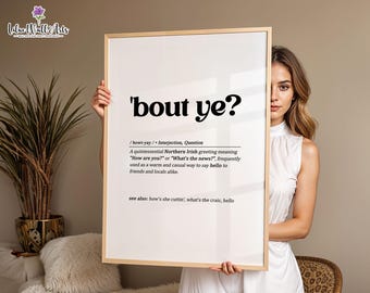 May include: A rectangular wall art print in a light wood frame featuring the black text 'bout ye? followed by phonetic pronunciation, part of speech, and a definition explaining the Northern Irish greeting, with a see also section at the bottom.