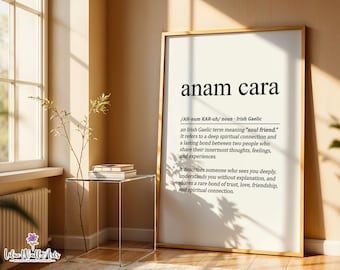 May include: A framed wall art print featuring the definition of the Irish Gaelic term anam cara. The text includes the pronunciation, part of speech, and a detailed explanation of the phrase meaning soul friend, printed in black on a white background.