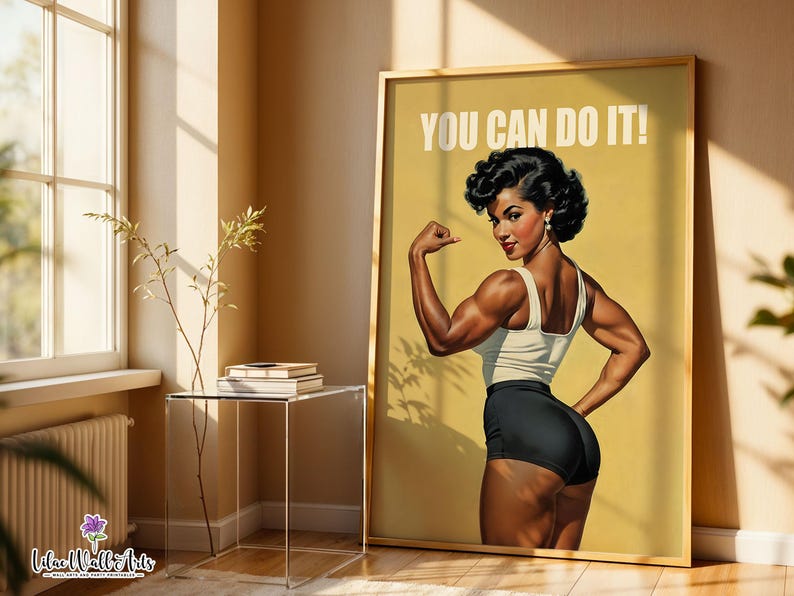 May include: A framed poster featuring a muscular figure in a white tank top and black shorts, flexing an arm with the text YOU CAN DO IT! printed in white at the top. The artwork is set against a solid yellow background with a vintage aesthetic.