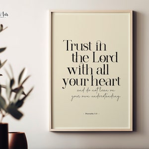 May include: A beige framed print with a white background and black text that reads "Trust in the Lord with all your heart and do not lean on your own understanding. - Proverbs 3:5 -"