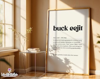 May include: A framed wall art print featuring the dictionary-style definition of the Irish slang term buck eejit in bold black text on a cream background, including phonetic pronunciation and a descriptive paragraph about the phrase.
