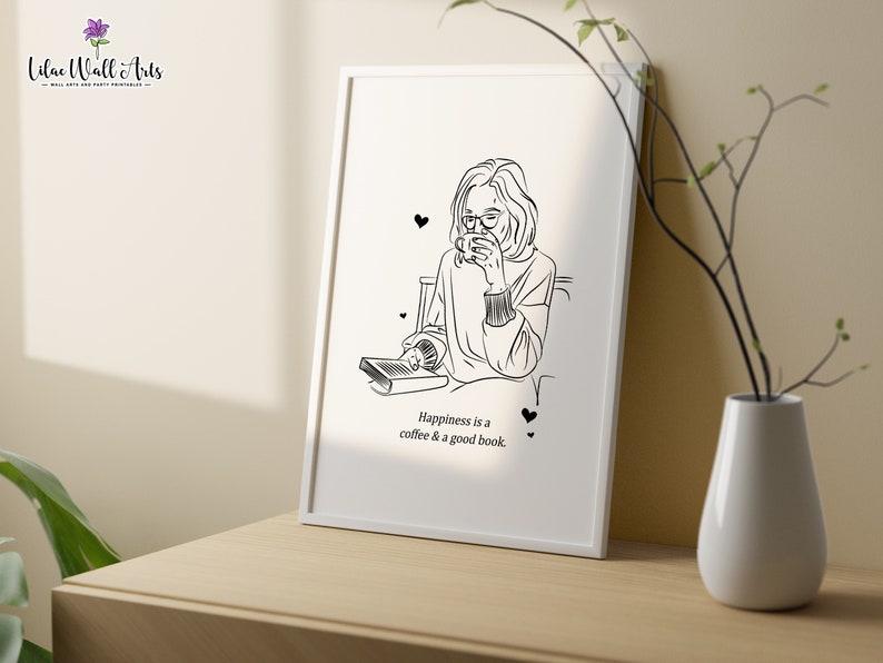 K&ouml;nnte beinhalten: Schwarz-wei&szlig;-Linienkunst-Illustration einer Person, die sitzt und ein Buch liest, w&auml;hrend sie eine Tasse Kaffee h&auml;lt. Der Text "Happiness is a coffee & a good book." befindet sich unter der Illustration.