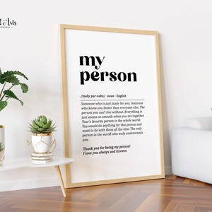 May include: A printable wall art print with a black and white definition of the word "person". The definition reads: "Someone who is just made for you. Someone who knows you better than everyone else. The person you can't live without. Everything is just seems so smooth when you are together. Your's favorite person in the whole world. You would do anything for this person and want to be with them all the time. The only person in the world who truly understands you. Thank you for being my person! I love you always and forever."