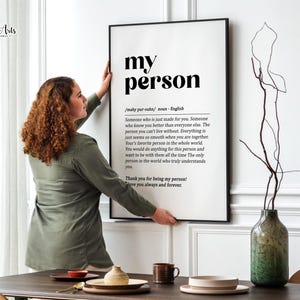 May include: Black and white printable wall art with the word "my person" in bold text. The definition of the word is written below in a smaller font. The definition reads: "Someone who is just made for you. Someone who knows you better than everyone else. The person you can't live without. Everything is just seems so smooth when you are together. Your's favorite person in the whole world. You would do anything for this person and want to be with them all the time. The only person in the world who truly understands you. Thank you for being my person! I love you always and forever."