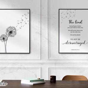 May include: Two black and white framed prints featuring a dandelion design. The print on the left shows two dandelions with seeds blowing in the wind. The print on the right has a quote from Deuteronomy 31:8, "The Lord himself goes before you and will be with you. He will never leave you nor forsake you. Do not be afraid. Do not be discouraged."