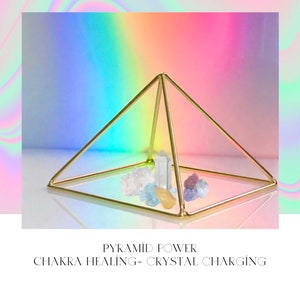May include: Gold geometric pyramid with crystals inside.  Pyramid power chakra healing - crystal charging.