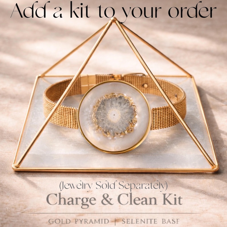 May include: A gold-colored mesh bracelet and a round pendant with a white and gray design are displayed inside a gold geometric pyramid. The text "Add a kit to your order" and "Charge & Clean Kit" are visible.