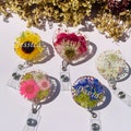 Custom Birth Flower Resin Badge Reel, Floral Badge Holder, Alligator Clip Badge Holder, Birthday Gift,  Nurses Gifts, Teachers Gift Ideas product logo