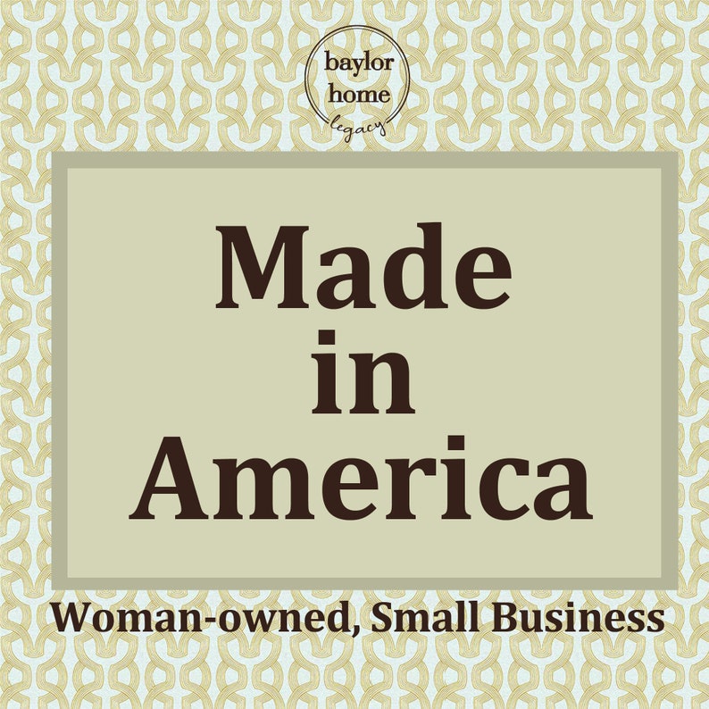 May include: A beige rectangle with a brown border and the text "Made in America" in large, bold, brown letters. Below the text is the phrase "Woman-owned, Small Business" in smaller, brown letters. The background is a light blue and gold pattern.