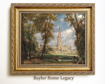 May include: A framed painting depicting a cathedral with a tall spire, surrounded by trees and a grassy field. The sky is blue with white clouds. The painting is in a gold frame with ornate details.