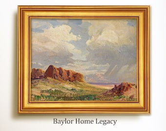 May include: A framed landscape painting depicting a desert scene with red rock formations, green vegetation, and a cloudy sky. The painting is in a gold frame and has the text "Baylor Home Legacy" below it.