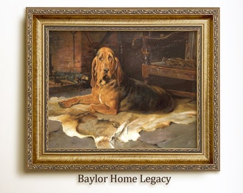 May include: A framed painting of a Bloodhound dog lying on a fur rug in a dimly lit room. The dog is brown and black with a long, droopy face. The painting is set in a gold frame with ornate details. The text "Baylor Home Legacy" is printed below the frame.