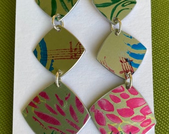 Funky anodised aluminium earrings, dyed in green with various colourful print designs