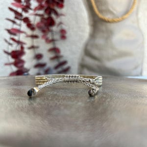 Back close-up view of the thin Miyuki bracelet. Adjustable with macrame knotting technique.