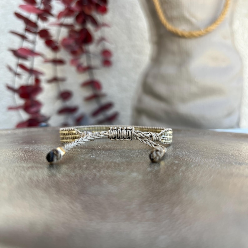 Back close-up view of the thin Miyuki bracelet. Adjustable with macrame knotting technique.