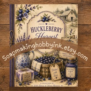 May include: A rectangular print titled Huckleberry Harvest featuring a rustic scene with a basket of blueberries, a blue and white pitcher, a bar of handmade soap, and a bottle of syrup. The illustration includes lavender sprigs and a barn.