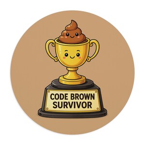 May include: A cartoon illustration of a gold trophy with a smiling poop emoji inside. The trophy sits on a black base with a gold plaque that reads "CODE BROWN SURVIVOR". The background is a solid tan color.
