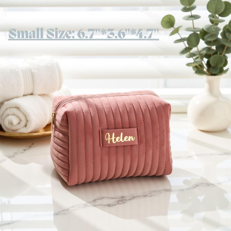 a small pink purse sitting on top of a table