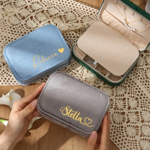 a pair of personalized jewelry cases sitting on a table