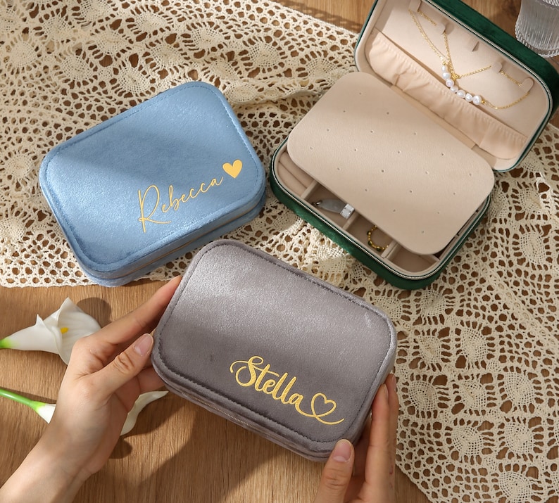 a pair of personalized jewelry cases sitting on a table