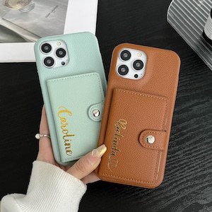a person holding a phone case in their hand
