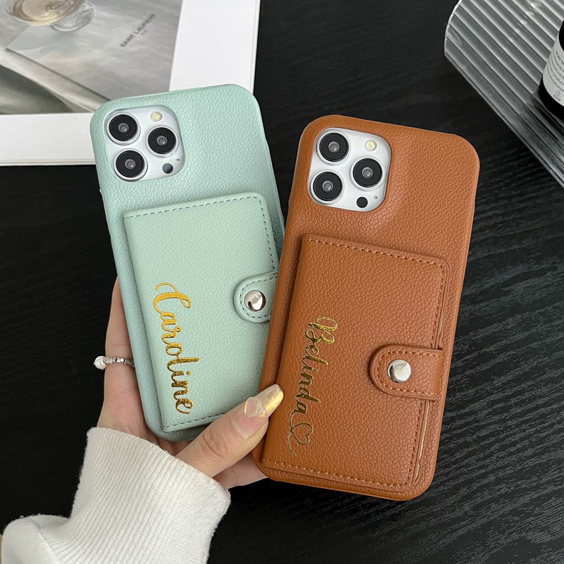 a person holding a phone case in their hand