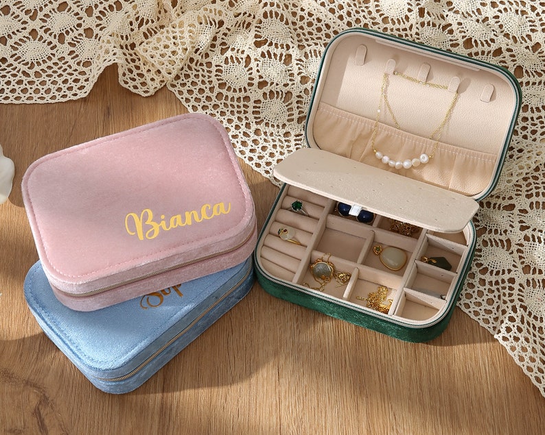 a couple of small boxes filled with jewelry