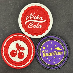 May include: A set of three ceramic mugs with a speckled, matte finish. The mugs are in shades of cream, light gray, and dark gray. Each mug has a simple, minimalist design, perfect for coffee or tea.