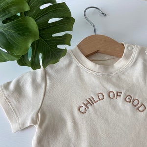 Shirt embroidered "Child of God"