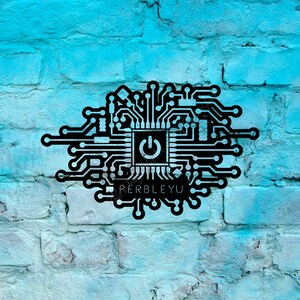 May include: Black metal wall art in the shape of a circuit board with a power button symbol in the center. The text "PERBLEYU" is below the power button. The art is mounted on a light blue painted brick wall.