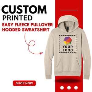 May include: A beige fleece pullover hooded sweatshirt with a front pocket and hood. The sweatshirt has a blank space for a logo. The image includes the text "CUSTOM PRINTED EASY FLEECE PULLOVER HOODED SWEATSHIRT" and a "SHOP NOW" button.