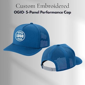 May include: A blue OGIO 5-Panel Performance Cap with a perforated mesh back and a snapback closure. The front panel features a circular white graphic with the text YOUR LOGO HERE. The text Custom Embroidered OGIO 5-Panel Performance Cap appears.