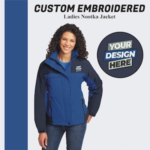 May include: A blue and black jacket with a zipper and a hood. The jacket has a patch on the left chest that says "YOUR DESIGN HERE".