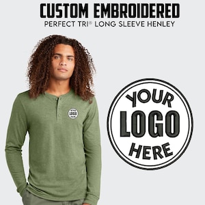 May include: A green long-sleeved henley shirt with a button placket and a small embroidered logo on the left chest. The logo is a circle with the text "YOUR LOGO HERE" in black.